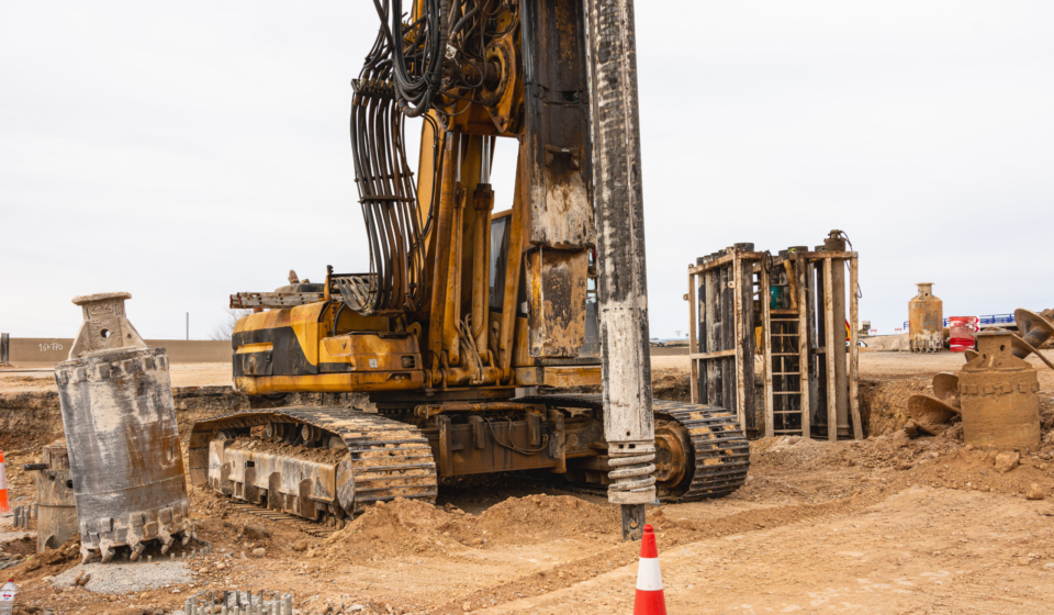 Construction site with machinery and supplies for ongoing construction